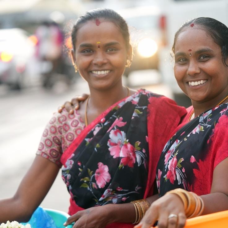 Avery Kim, Lead Design Curator at SilentTraderSilver, reviewing corporate floral arrangements